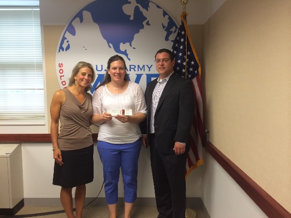 Jeremy Martin, chair of the Camden Yards Night event in August (r), and Ali Eyre, chapter vice president of events (l) are with Candace Godfrey, marketing manager from the Wounded Warrior Resiliency Center, who helped get the baseball tickets to members of the Army.