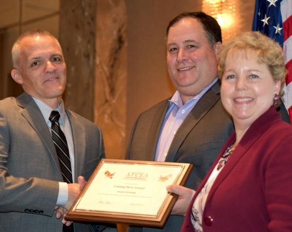 Chapter President Brian Cooper (c) and Jessica Morgenstern, vice president of scientific education, present Joe Karolchik the chapter's Unsung Hero award in January for his work on the Education Committee.