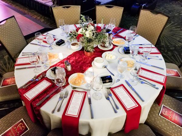 Dinner tables are festive for the February gala featuring dinner and dancing.