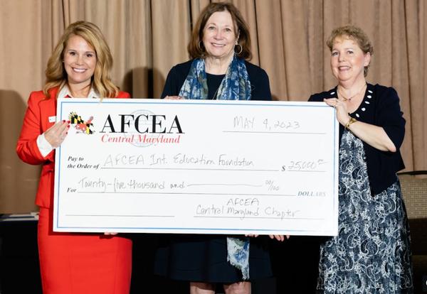 In May, Lt. Gen. Susan Lawrence, USA, CEO and president, AFCEA International (c), accepted the chapter's $25,000 contribution to AFCEA International Education Foundation.