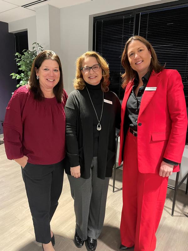 (l-r) Mary Stewart, Tracey Michael and Kirsten Miller-Jones enjoy networking at the Holiday Social in December.