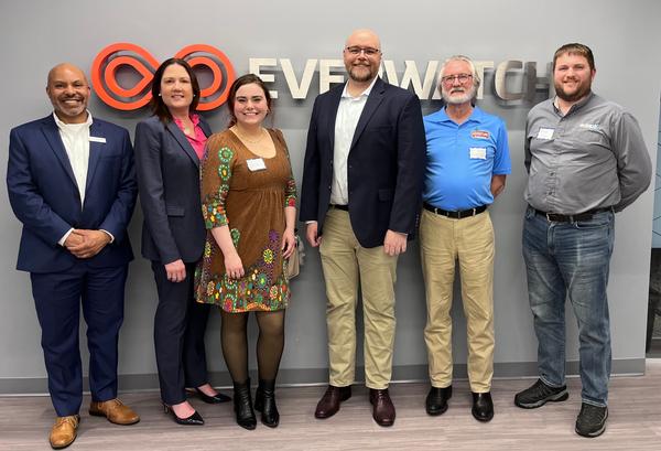 Panel members pose for a photo at the March event.
