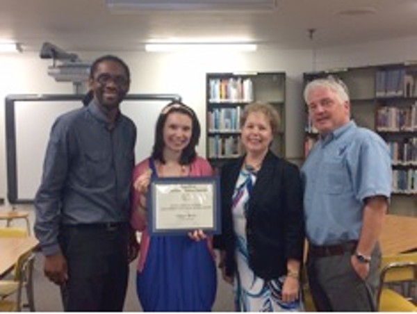 In October, Morgenstern (2nd from r) honors Ginger Berry (2nd from l), a teacher at Argyle Middle School in Silver Spring, Maryland, with a scholarship. James Allrich, principal at Argyle Middle School, and Geoff Edgar, assistant principal attend the October presentation.