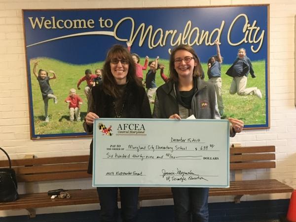 In December, teachers Laura Cooke (l) and Carly Legg Wood accept their first STEM grant from the chapter for Maryland City Elementary School.
