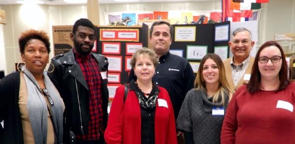 Chapter members volunteer in December at the Meade High School science fair. Volunteers include (from l) Johnson, Jean Paul Cameron, Jessica Morgenstern, Mark McLarnon, Jennifer Kielman, John Garcia and Karen Young.