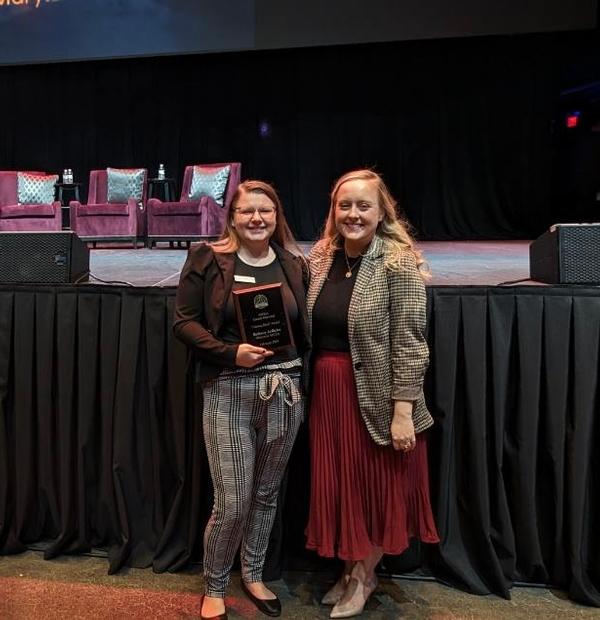 Jedlicka poses with her award and Amy Fanning, vice president of the chapter's Women in AFCEA committee, at the February luncheon.
