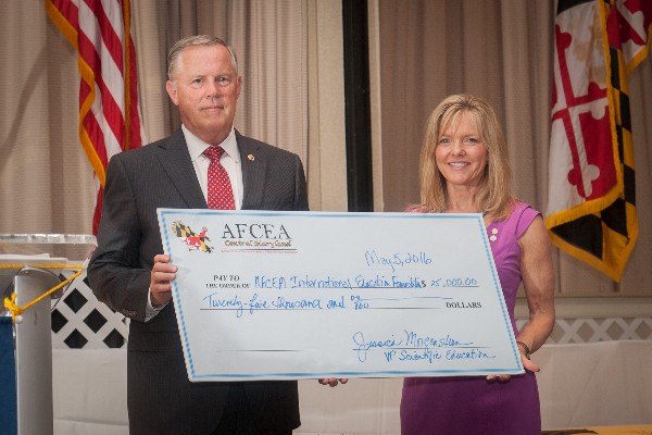 Susan Lepera, chapter president, presents a check to Lt. Gen. Robert M. Shea, USM (Ret.), president and CEO of AFCEA International for the AFCEA International Education Foundation at the event in May. 