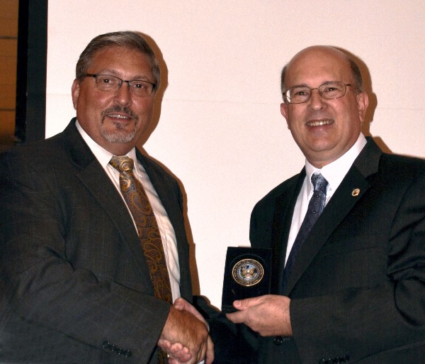 Bill Layman (l), chapter vice president of luncheons, thanks guest speaker Peter Dinsmore, technical executive for DISA's Development and Business Center, for his presentation to the chapter in September. 