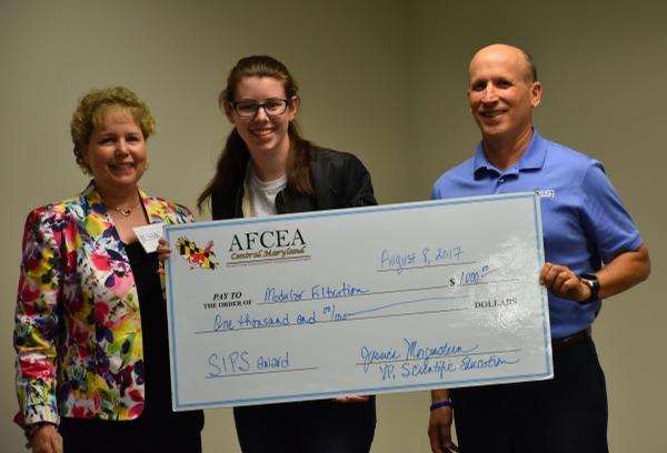 Morgenstern and Rosen present Anna Blendermann with her Best Technical Project award at the Summer Intern Presentation Showcase in August. 
