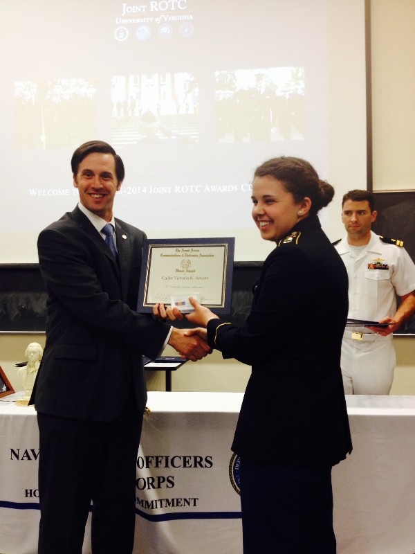 Cadet Victoria Amato, Army ROTC, accepts an ROTC Award from Joe Reagan, chapter vice president for small business, in April.