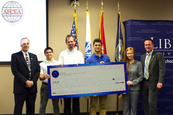 Dean Strong (far l) and Adrian Felts, chapter president (far r), present a STEM Award check to the student chapter at Liberty University in September. Students pictured from l-r include    Daniel Kratt, AFCEA Liberty University Chapter President, and scholarship winners Daniel Adams, Jordan Kehr and Emily Stokes.
 