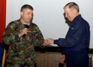 Maj. Jonathan A. Sutherland, USAF (l), subchapter president, thanks Gen. Verbeck for serving as the guest speaker in May.