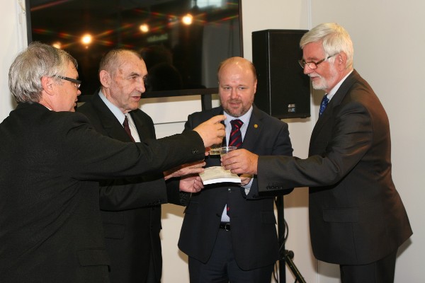 Celebrating the May launch of the cybersecurity glossary are (from left) Josef Strelec, chapter president; Josef Pozar, co-author and dean of the Police Academy of the Czech Republic in Prague; Petr Jirasek, co-author and chairman of the Czech Cyber Security Working Group; and Milan Kny, editor, Police Academy of the Czech Republic in Prague.