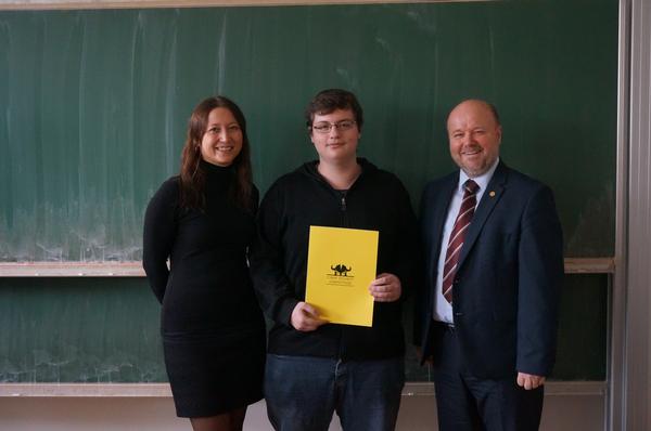 First-round winner Matous Kulhan (c) receives a certificate from competition partner Andrea Konopaskova of Alef Nula and Petr Jirasek, AFCEA regional vice president, after the November contest.