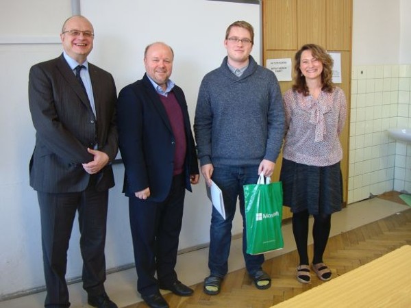 Jakub Kolacek (2nd from r), a second round finalist from Mnichovo Hradiste High School, meets with Dr. Lenka Sosnovcova (r), school director; Tomas Pribyl (far l), president, European Cyber Security Excellence Center; and Petr Jirasek, chairman, Czech Cyber Security Working Group, after the competition in March. 