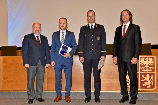 In September, Petr Jirasek, regional vice president of Central Eastern Europe (l), and Tomas Muller, chapter president (r), present silver AFCEA Czech Medal to Lukas Kintr, director, NCISA (second from l), and Brig. Gen. David Dlouhy (Ret.), Chancellor Police Academy of the Czech Republic (second from r), for their meritorious service to AFCEA on the 100th CCSWG event and 25 years of the cooperation between AFCEA and the Police Academy.