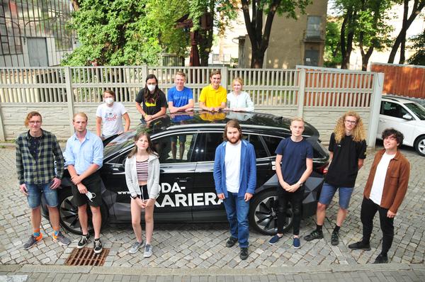 Students and winners of the fifth edition of the Czech National Cyber Security Competition pose for a photo with a Skoda Enyaq iV in July. Skoda Auto is one of two general partners of the national competition.