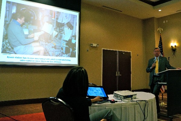 NASA astronaut Mark Brown addresses more than 250 members at the chapter's July luncheon.