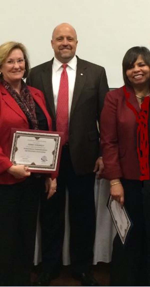 April luncheon panelists Debbie Tankersley, Northrop Grumman (l), and Jean Smith, Air Force Materiel Command director of small business, Wright-Patterson Air Force Base (r), with Chapter President David Hart, wrap up the small business speaker series.