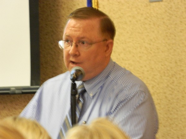 Terry Edwards, director of communications, installations and mission support, headquarters, Air Force Materiel Command, speaks at the November chapter lunch about the command's reorganization.