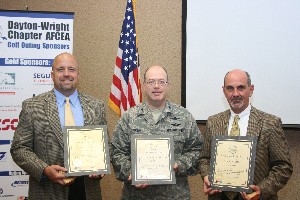 Receiving AFCEA Life Member certificates at the July meeting are (l-r) David Hart, chapter president, Col. Michael Stinson, USAF, and Dan Curtis.

