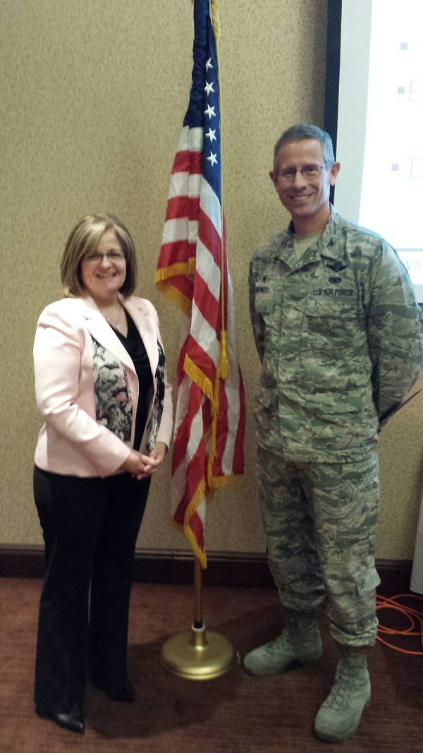 Chapter President Linda Skinner presents Col. Schnulo with a chapter coin and certificate of appreciation at the November luncheon.