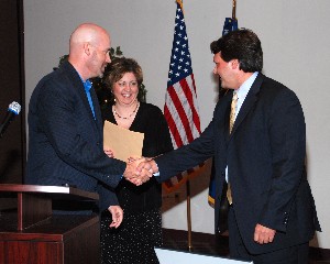 Michelle Corcoran, chapter president, and Gary Ahrens (l), vice president for chapter programs, thank Brent Gibson, deputy director of the 554th Electronic Systems Group, Headquarters Air Force Materiel Command, Wright-Patterson Air Force Base, Ohio, for his presentation at the June meeting.

