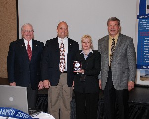 At the May luncheon, members accepting AFCEA International awards are (l-r) Fred Scheyd, regional vice president; Dave Hart, chapter president; Brenda Colton, chapter secretary; and Craig McCombs, chapter vice president.