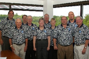 Committee members for the Spring Swing golf tournament gather during the event in May, which generated $5,000 for the scholarship fund.

