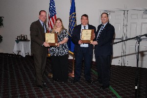 Dave Judson (l), chapter president, and Norm Nelson (r), chapter executive vice president, present Wanda and Michael Markowski with their lifetime membership certificates at the May meeting.