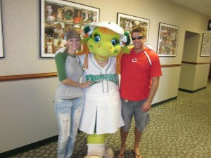 Chapter members Kari Recker (l) and Brian Osborne (r) join Gem, the mascot for the Dayton Dragons minor league baseball team, during the chapter's community event in September.