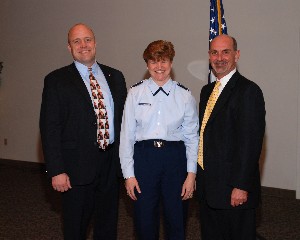 Discussing chapter business at the March luncheon are Dave Hart, chapter president (l); Lt. Gen. Janet Wolfenbarger, USAF; and Dan Curtis, chapter vice president for programs.
