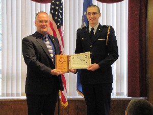Receiving a $500 scholarship from Fauch (l) in May is Cadet Jordan McShirley, Sinclair Community College.

