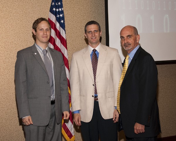 Casey Weinstein (l), chapter vice president for speakers, and Dan Curtis (r), chapter president, thank David Drake, technical adviser, information technology, Communications and Information Directorate, National Air and Space Intelligence Center, for his speech at the April meeting.