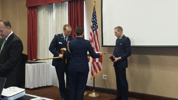 Members of the Honor Guard prepare the room for the March luncheon.