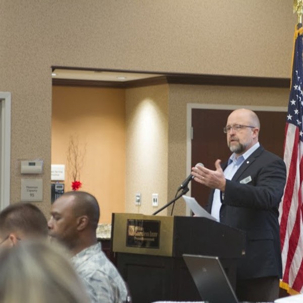 Chapter President David Hart introduces Gen. Skinner as the guest speaker at the chapter's luncheon in December. 