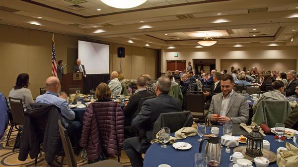 Chapter members mix and network before the January luncheon.