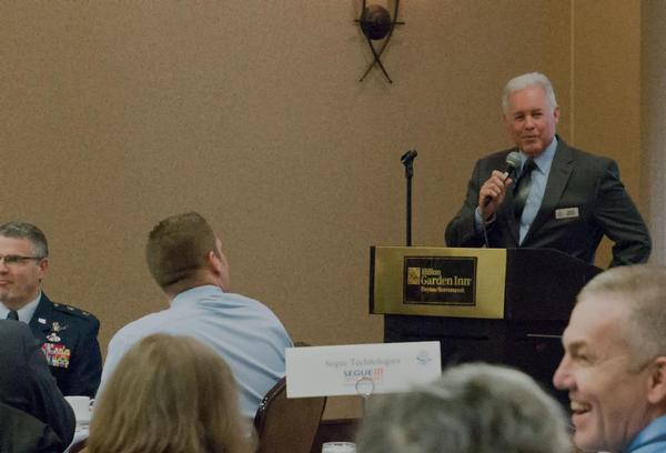 Chapter President David Dodds announces the 2019 science and technology luncheon speaker schedule, spring scholarship and summer fundraisers to members at the February meeting.