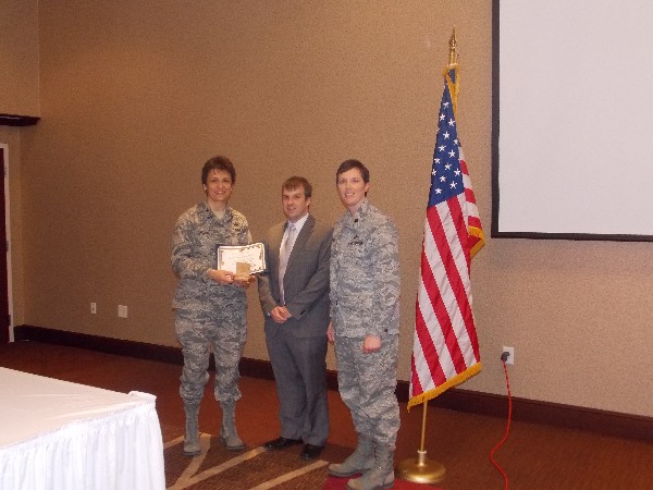 Lt. Col. Brenda Oppel, USAF (r), and Miller recognize the January luncheon speaker Col. Cassie Barlow, USAF, 88th Air Base Wing and Installation commander, Wright-Patterson Air Force Base.