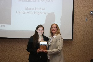 In July, Whittaker (r) presents the chapter's Julie O'Brien Scholarship to Marie Hucke from Centerville High. The chapter established the scholarship in memory of a cherished member.