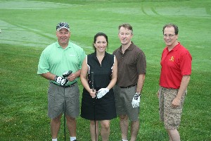In June, participants raising scholarship funds at the chapter's golf outing are (l-r) Ed Decker, senior director, business operations, BTAS Incorporated; Angela Fronista, president and chief executive officer, BTAS Incorporated, and her husband Chad Rayburn; and Jeff Liffick, director of business development, BTAS Incorporated.