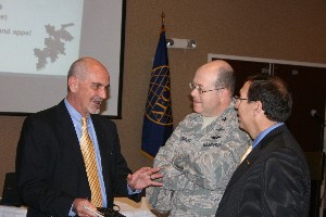 Curtis (l) speaks with Col. Michael J. Stinson, USAF (c), and another chapter member before the November luncheon.