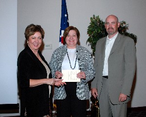 At the June meeting, Michelle Corcoran, chapter president (l), and Gary Ahrens, vice president of chapter programs, thank guest speaker Lorna B. Estep, executive director, Air Force Global Logistics Support Center, Air Force Materiel Command, Wright-Patterson Air Force Base, Ohio.