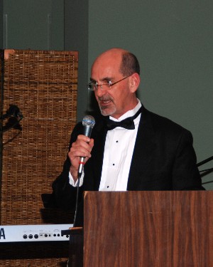 Dan Curtis, chapter officer, provides the opening remarks for the February Valentine's Ball. The event's proceeds benefit the chapter's scholarship and educational programs.