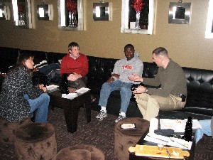 Col. Rob Lyman (r) explains the White House Fellow program to the Young AFCEANs at the December event.