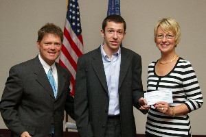 Tritle (l) and Kathy DeMolet, chapter vice president for education, recognize Zachary Duberstein (c), recipient of the Julie O'Brien Memorial Scholarship Fund, in July.