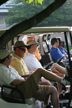 Participants in the Spring Swing golf tournament and fundraiser prepare for the event to begin.