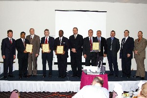 Tritle (l) poses with representatives from the chapter's new corporate members.