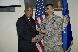 Lt. Barrett Darnell, USAF (r), receives the Regional Distinguished Young AFCEAN Award from Col. Lou Ramos, USAF (Ret.), regional vice president, at the January meeting.