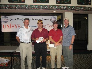 At the chapter's successful golf tournament in November, winners included (lt to 3rd from r) Charlie Churillo, Andy Drohan and Tom Bandfield, congratulated by Lt. Col. Rob Lyman, USAF (r) chapter president. Also on the team was Steve Surber, not pictured.
